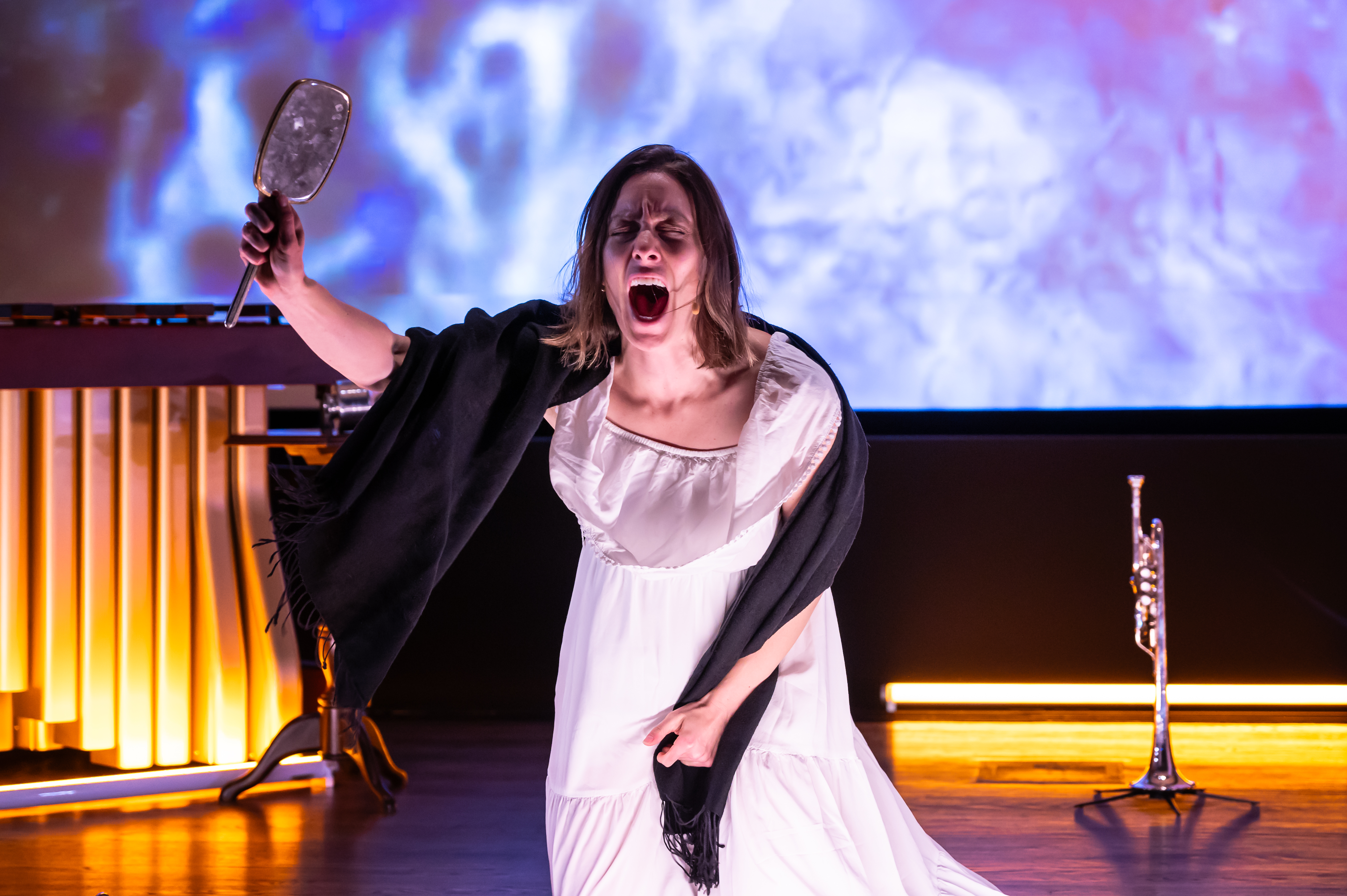 Performer on the ground, screaming